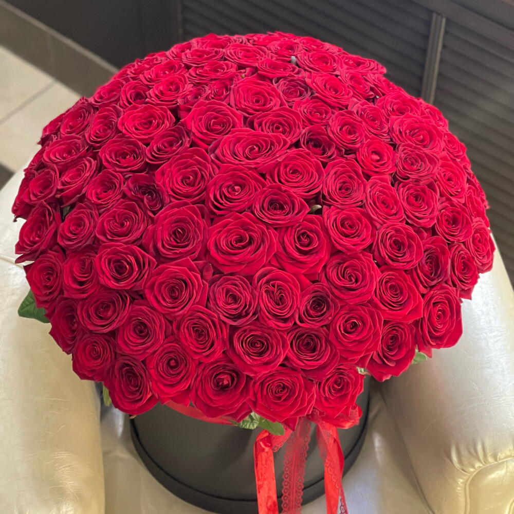 Bouquet of red roses on a white surface